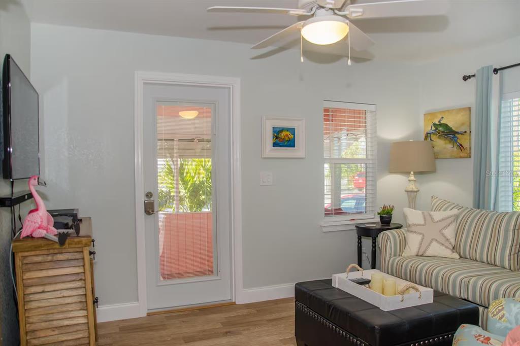 13136 4th Street East Madeira Beach, FL 33708 - Photo 47 of 75 a living room with furniture and a window