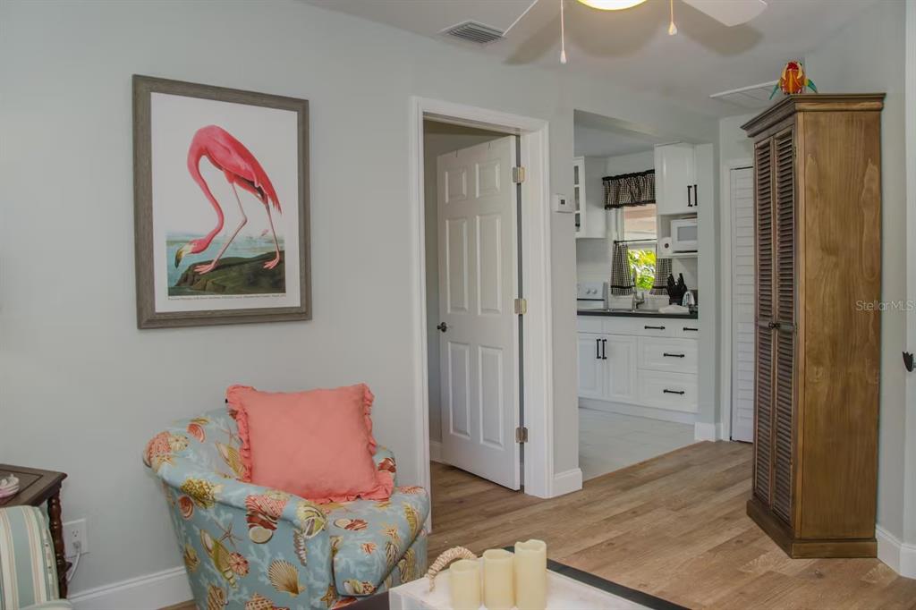 13136 4th Street East Madeira Beach, FL 33708 - Photo 48 of 75 a living room with furniture and wooden floor