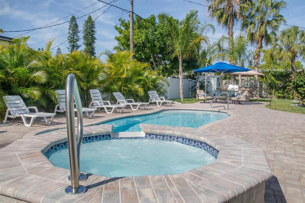13136 4th Street East Madeira Beach, FL 33708 - Photo 52 of 75 swimming pool view with a garden space