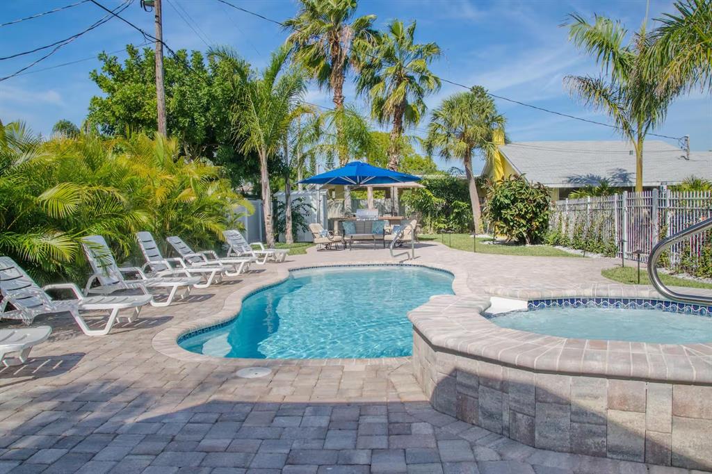 13136 4th Street East Madeira Beach, FL 33708 - Photo 55 of 75 a view of a backyard with a fountain