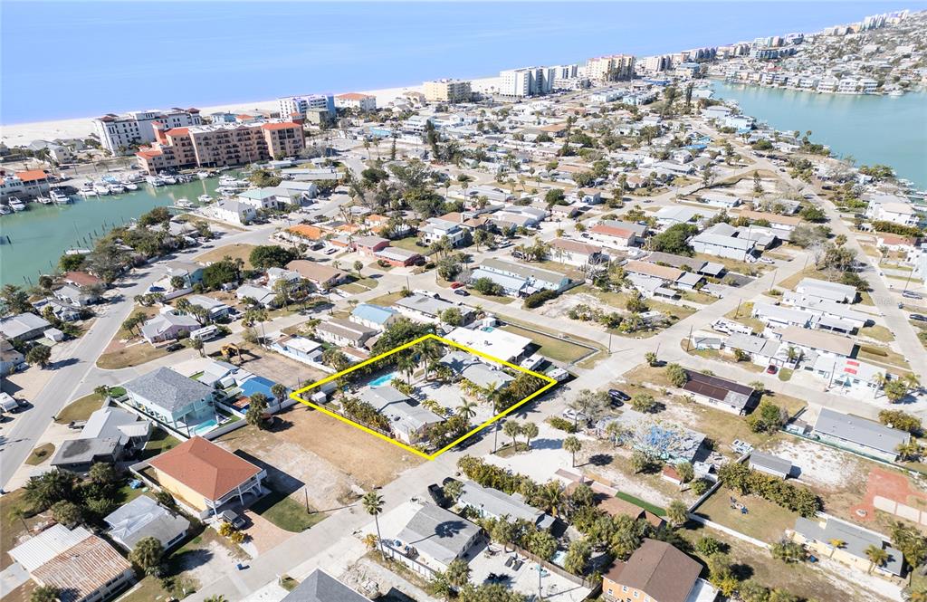 13136 4th Street East Madeira Beach, FL 33708 - Photo 59 of 75 an aerial view of residential building with parking space