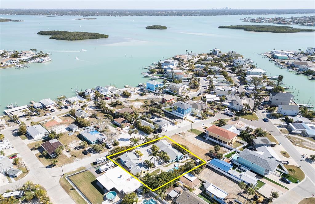 13136 4th Street East Madeira Beach, FL 33708 - Photo 63 of 75 an aerial view of a house with a lake view