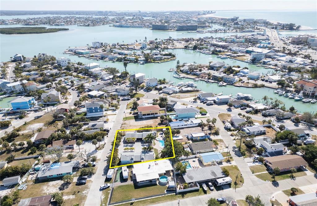 13136 4th Street East Madeira Beach, FL 33708 - Photo 64 of 75 an aerial view of a city with lake view