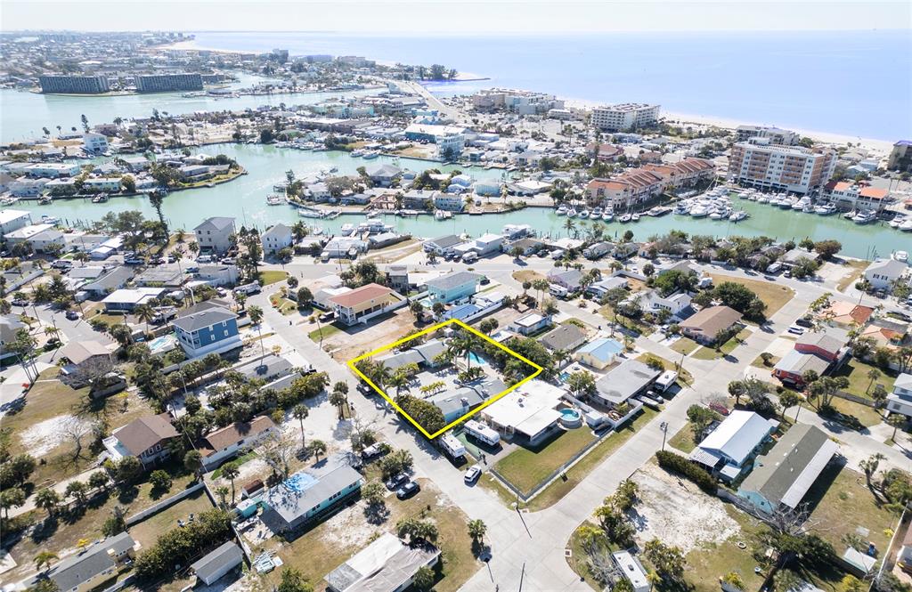 13136 4th Street East Madeira Beach, FL 33708 - Photo 65 of 75 an aerial view of a city with lots of residential buildings