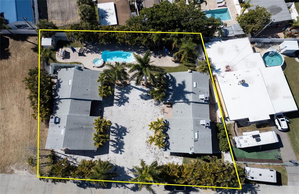 13136 4th Street East Madeira Beach, FL 33708 - Photo 68 of 75 an aerial view of houses with outdoor space