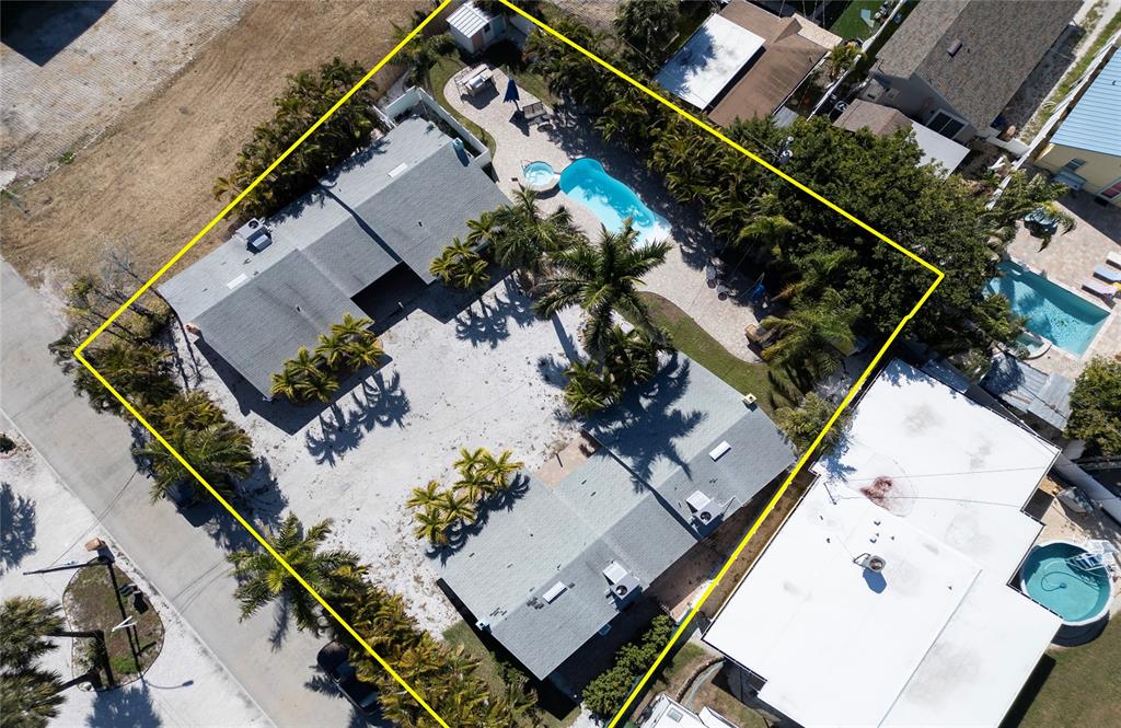 13136 4th Street East Madeira Beach, FL 33708 - Photo 69 of 75 an aerial view of a house with a garden