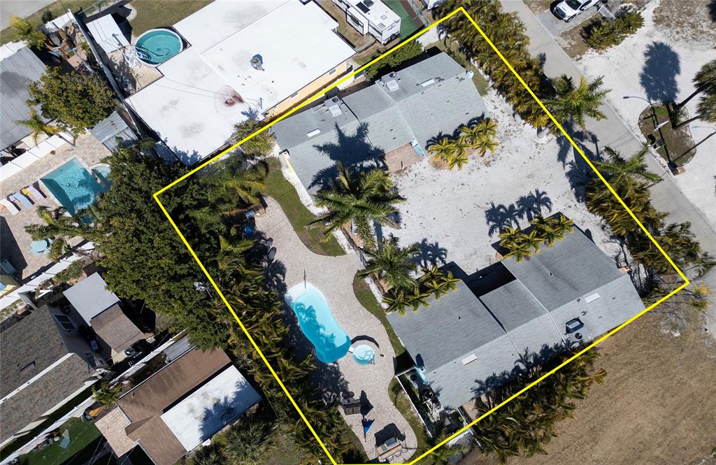 13136 4th Street East Madeira Beach, FL 33708 - Photo 73 of 75 an aerial view of a house with a swimming pool