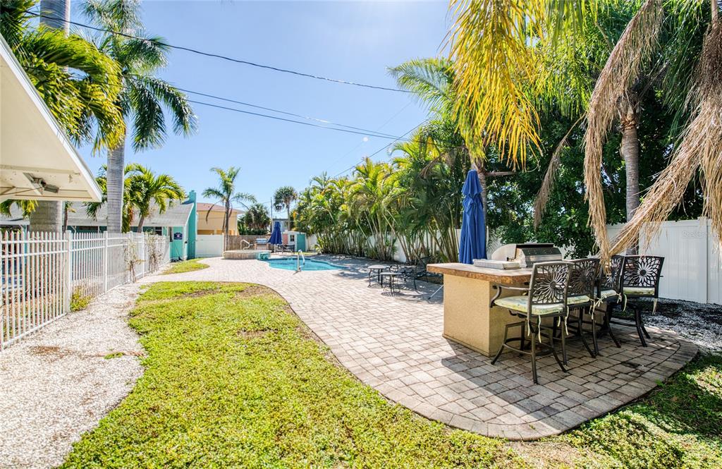 13136 4th Street East Madeira Beach, FL 33708 - Photo 10 of 75 a view of a swimming pool with a patio