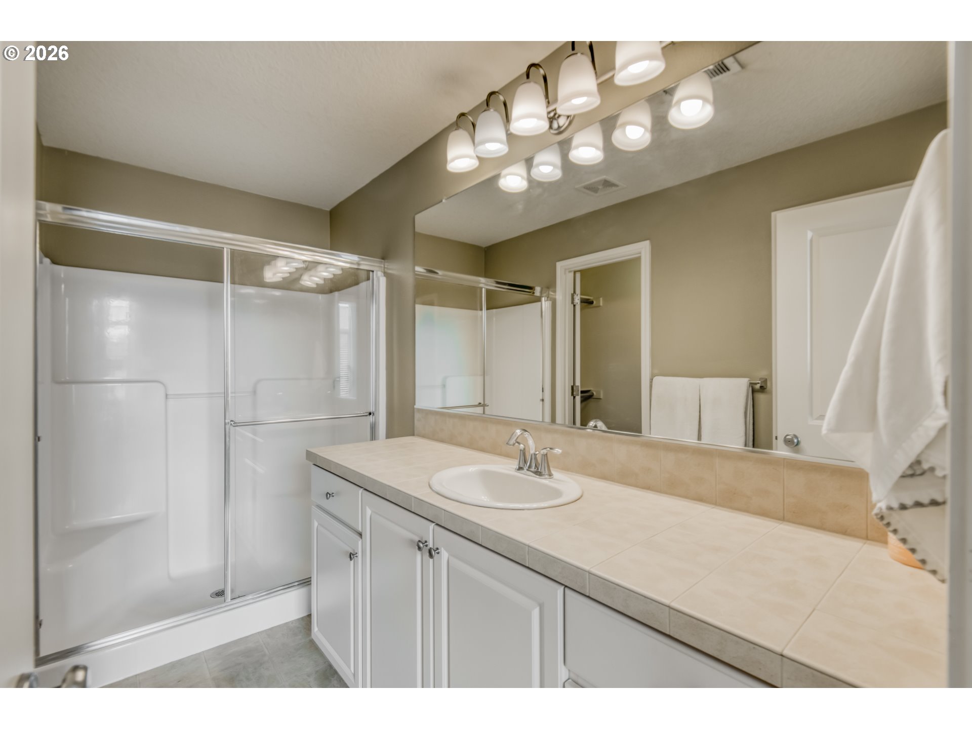 16133 Northwest Hildago Lane Portland, OR 97229 - Photo 11 of 29 a bathroom with a sink vanity and a mirror