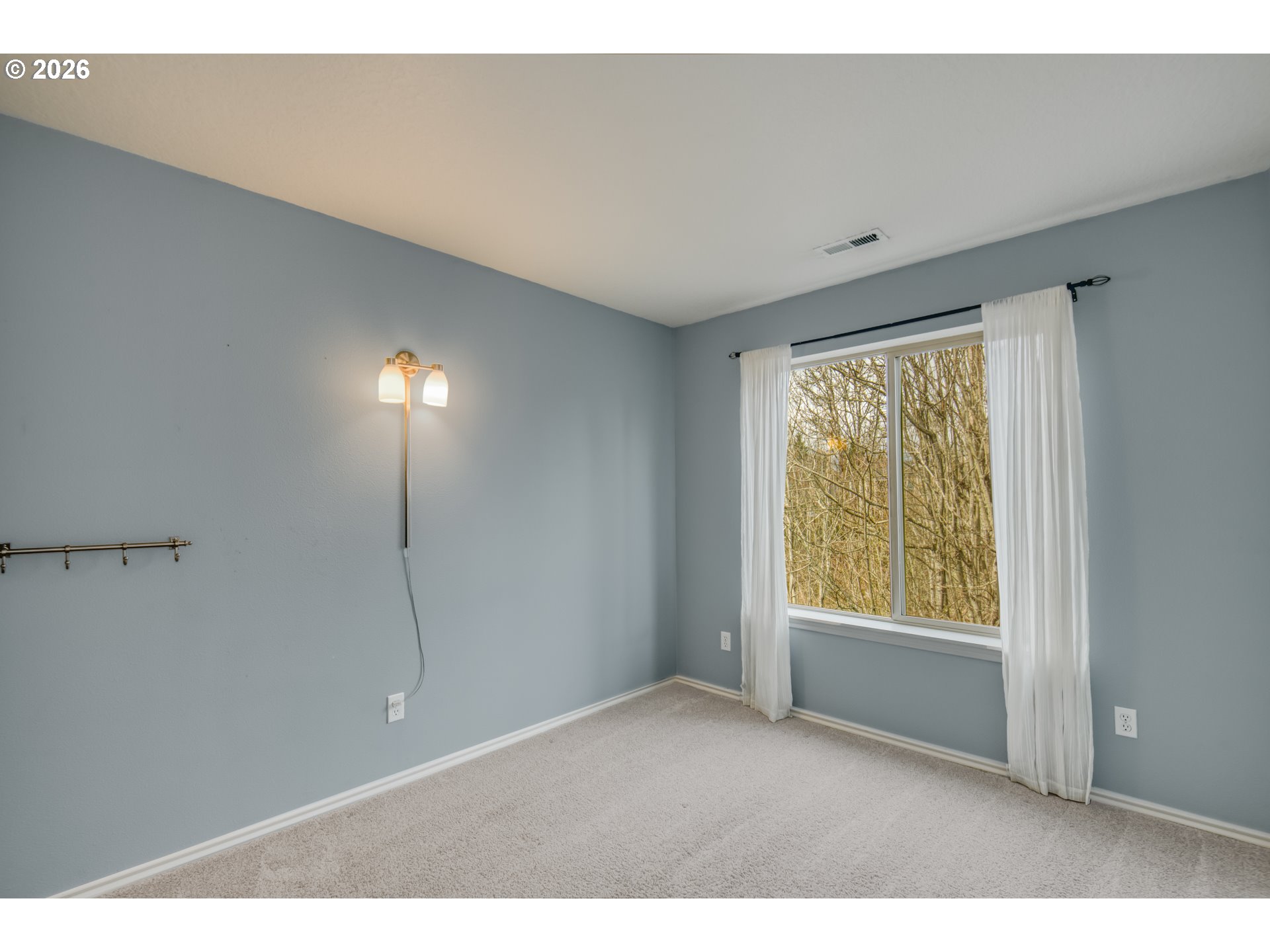 16133 Northwest Hildago Lane Portland, OR 97229 - Photo 13 of 29 a view of an empty room with a window