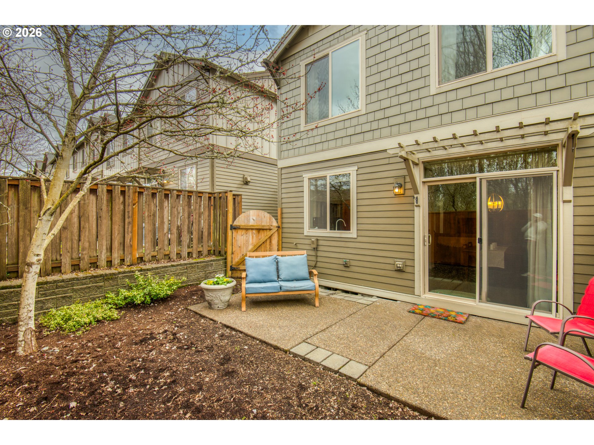 16133 Northwest Hildago Lane Portland, OR 97229 - Photo 19 of 29 a backyard of a house with outdoor seating