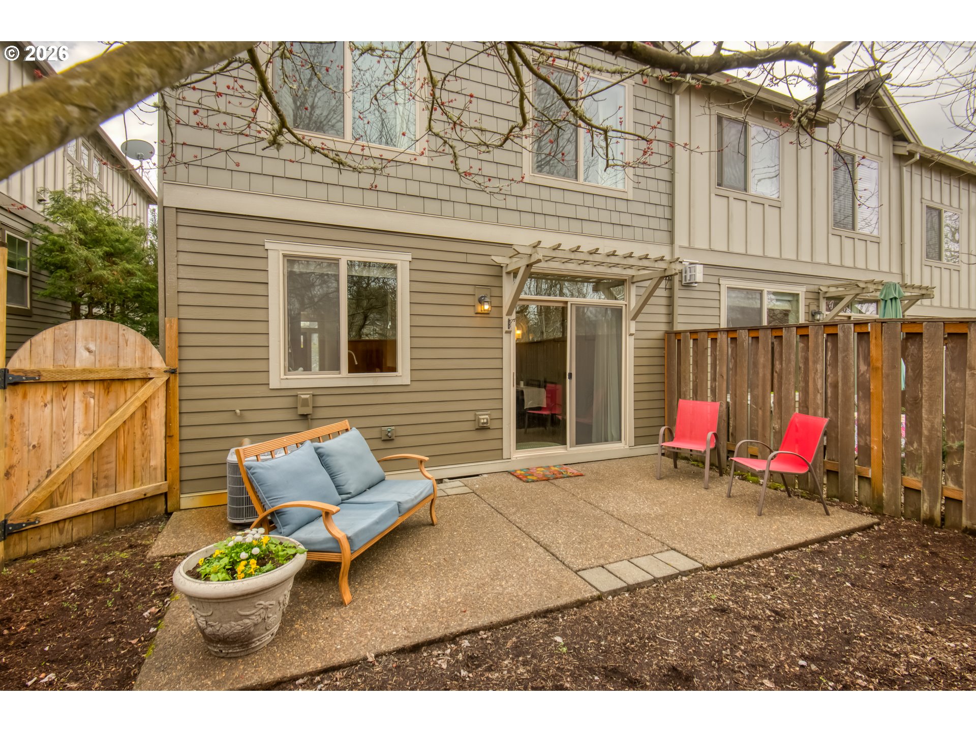 16133 Northwest Hildago Lane Portland, OR 97229 - Photo 20 of 29 a view of a patio with table and chairs and potted plants