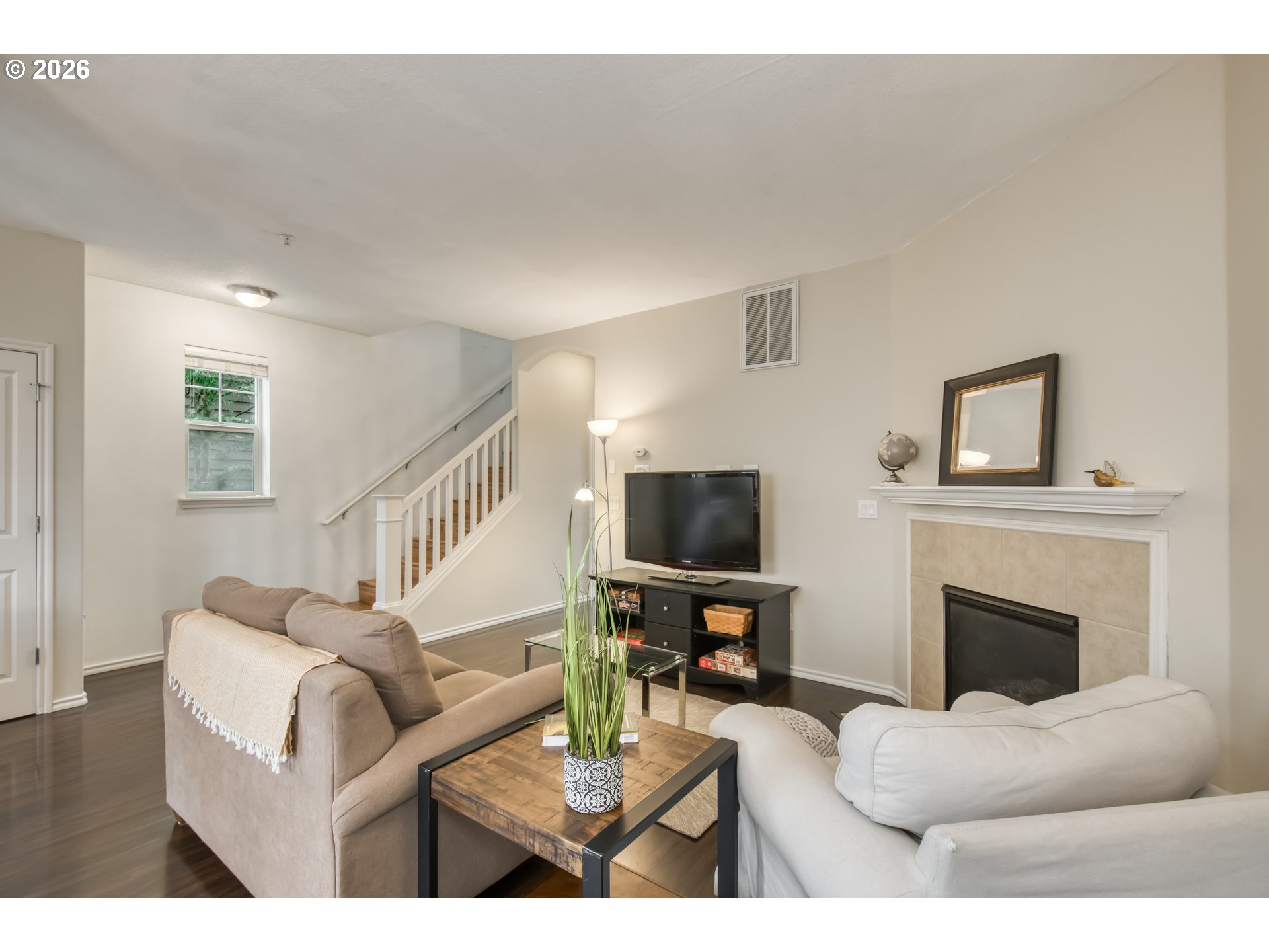 16133 Northwest Hildago Lane Portland, OR 97229 - Photo 2 of 29 a living room with furniture a fireplace and a flat screen tv