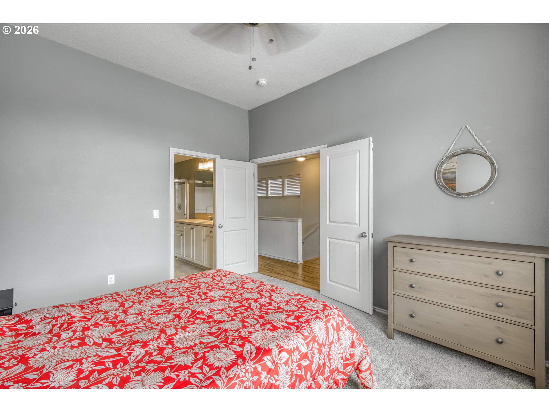 16133 Northwest Hildago Lane Portland, OR 97229 - Photo 10 of 29 a bedroom with a bed and cabinets