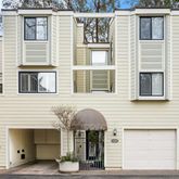 a front view of a house with a garage