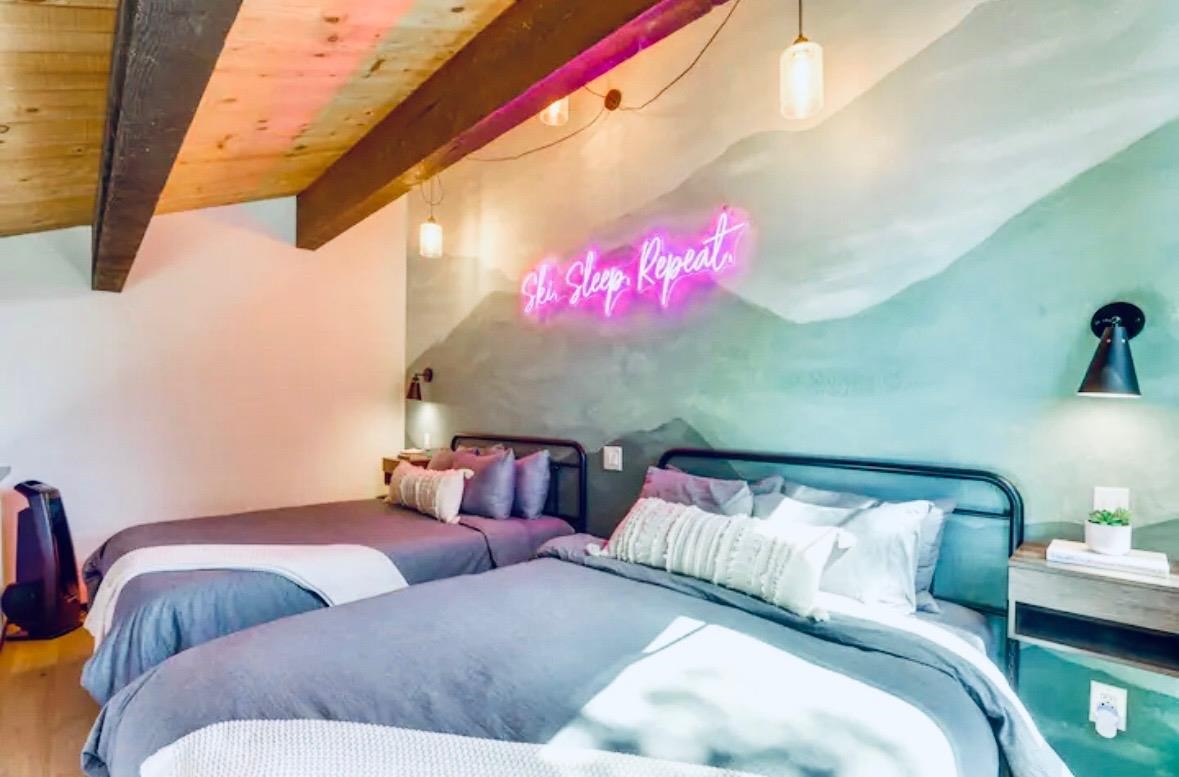 1001 Commonwealth Drive, Unit 218 Kings Beach, CA 96143 - Photo 14 of 28 a bedroom with a bed and a couch