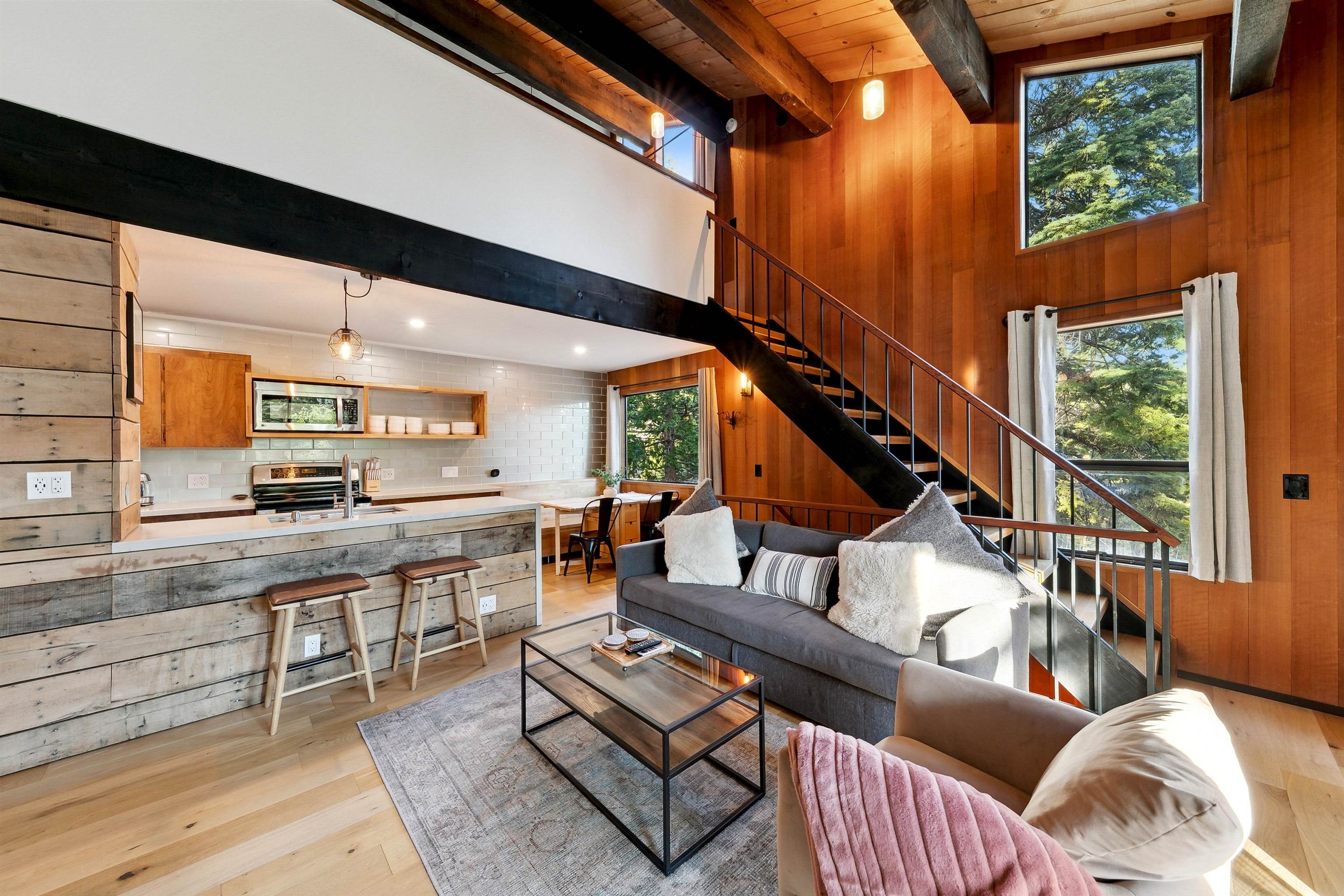 1001 Commonwealth Drive, Unit 218 Kings Beach, CA 96143 - Photo 4 of 28 a living room with furniture and a large window