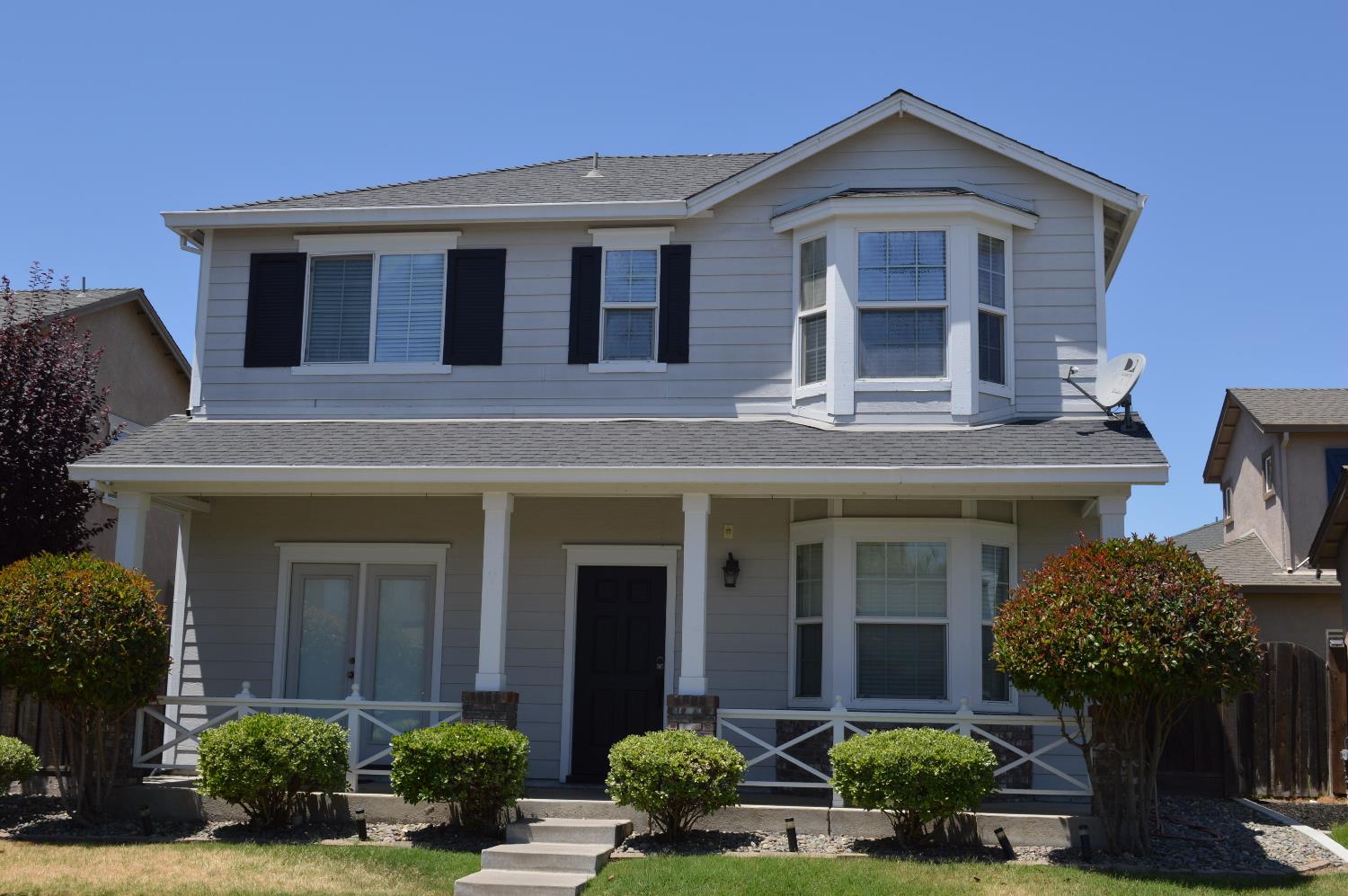 4227 Ivory Lane Turlock, CA 95382 - Photo 2 of 60 a front view of a house with garden