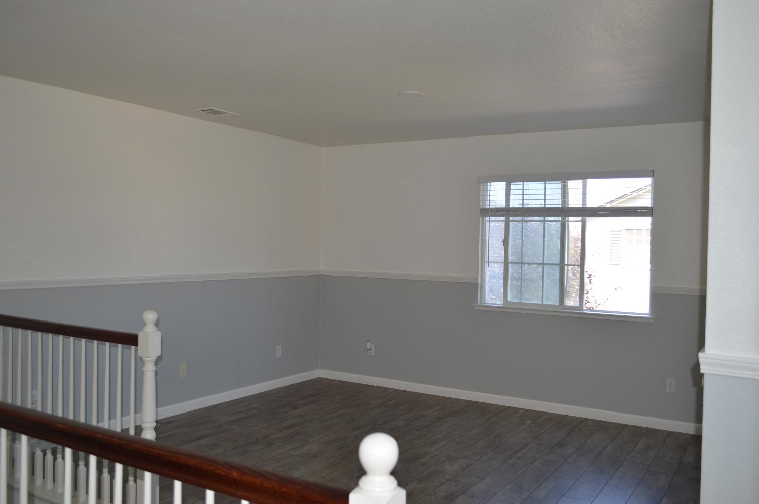 4227 Ivory Lane Turlock, CA 95382 - Photo 21 of 60 an empty room with windows