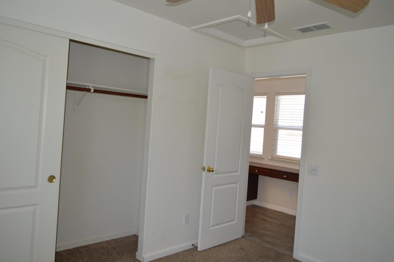 4227 Ivory Lane Turlock, CA 95382 - Photo 32 of 60 wooden floor in an empty room with a window