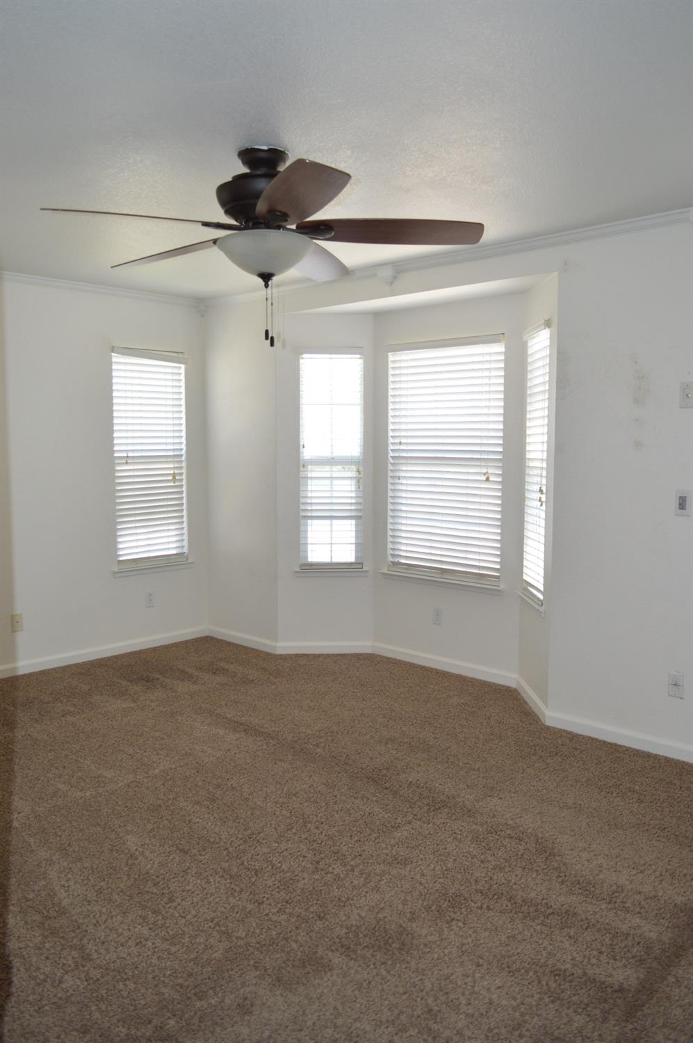 4227 Ivory Lane Turlock, CA 95382 - Photo 40 of 60 a view of an empty room with a window