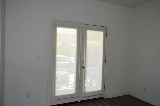 a view of a bathroom with wooden floor
