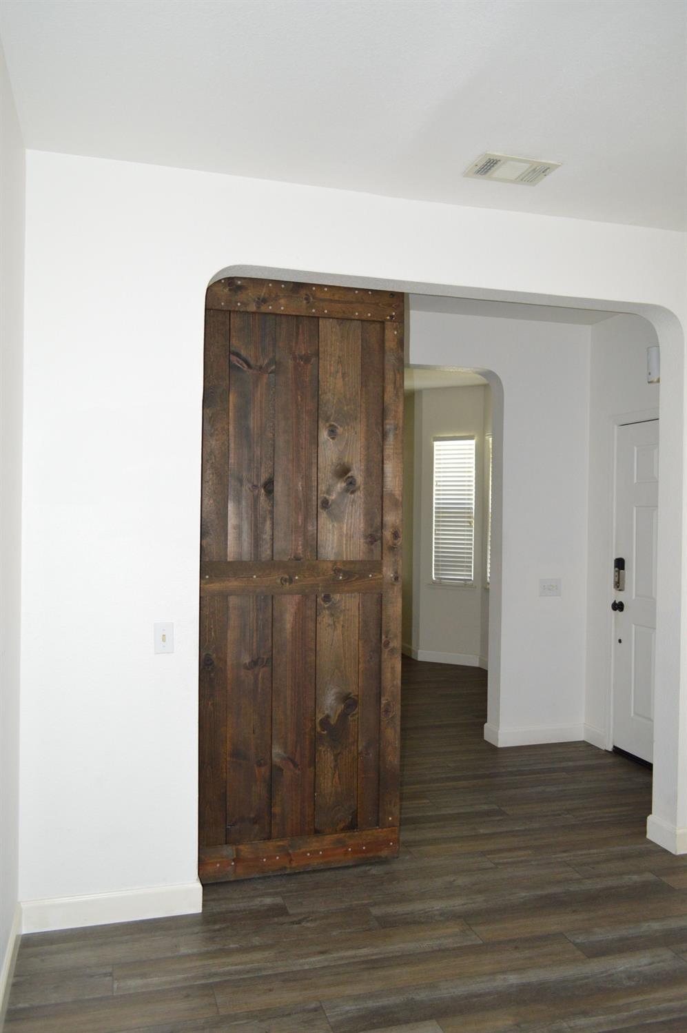 4227 Ivory Lane Turlock, CA 95382 - Photo 8 of 60 a view of a bathroom with wooden floor