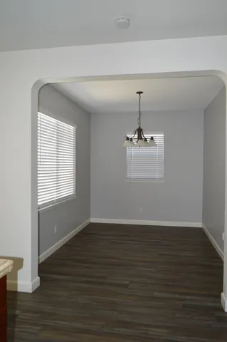 a kitchen with a sink stove and microwave