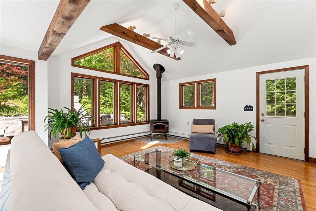 371 Longley Road Groton, MA 01450 - Photo 5 of 33 a living room with furniture and a large window