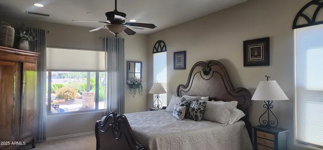 a bedroom with bed and a window