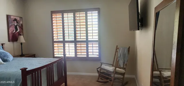 a view of room with window and furniture