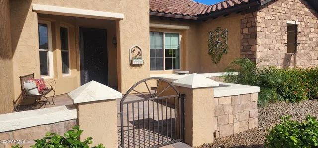 a view of a patio with a table and chairs