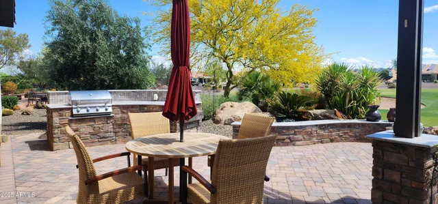 a view of a table and chairs in the patio