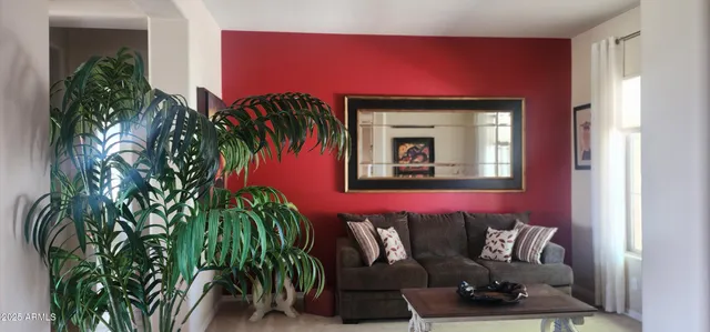 a view of a livingroom with furniture and a potted plant