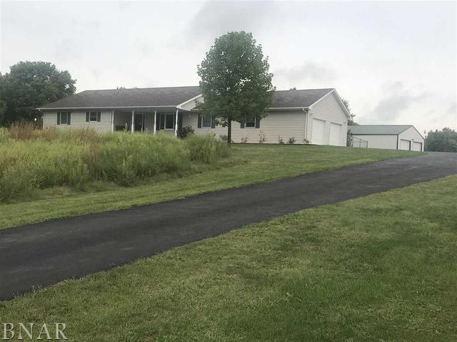 a view of a house next to a yard and road