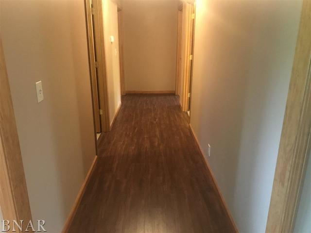 9563 Clintonia Road Clinton, IL 61727 - Photo 11 of 45 a view of a hallway with wooden floor