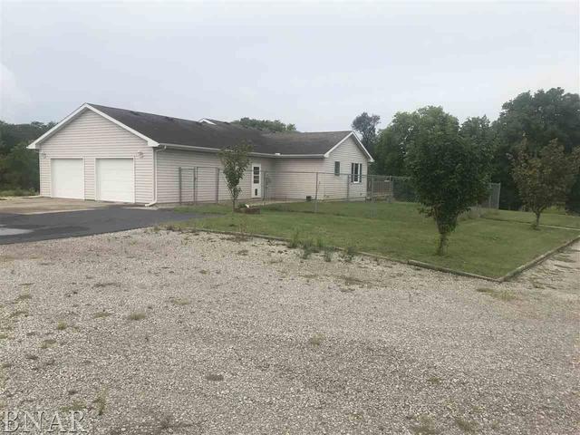 9563 Clintonia Road Clinton, IL 61727 - Photo 37 of 45 a front view of a house with a yard and garage