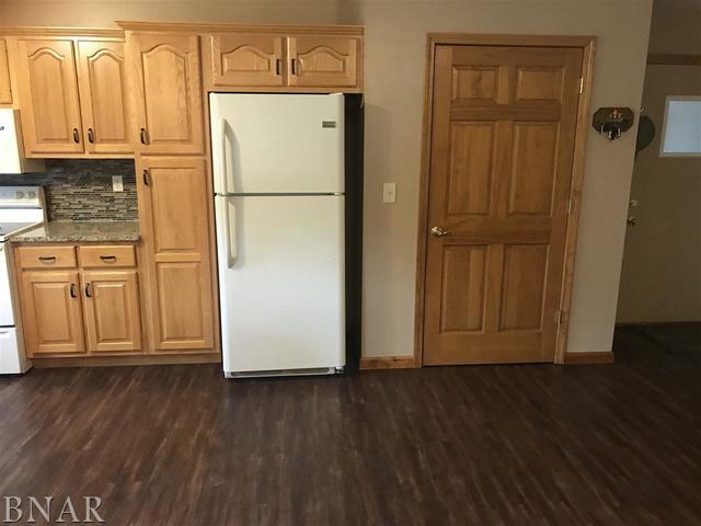 9563 Clintonia Road Clinton, IL 61727 - Photo 7 of 45 a view of a refrigerator with wooden floor
