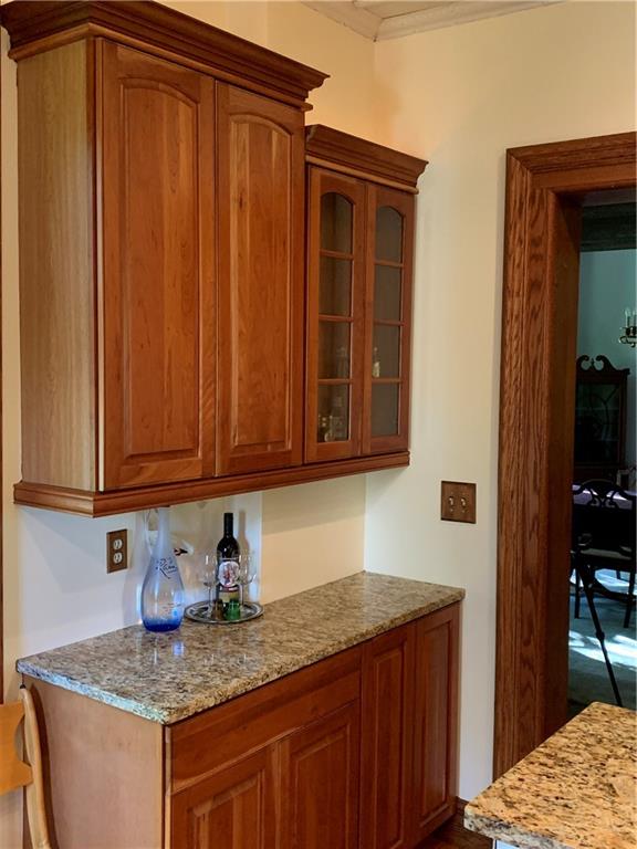 12833 Conneaut Lake Road Conneaut Lake, PA 16316 - Photo 11 of 25 a kitchen with granite countertop cabinets and sink