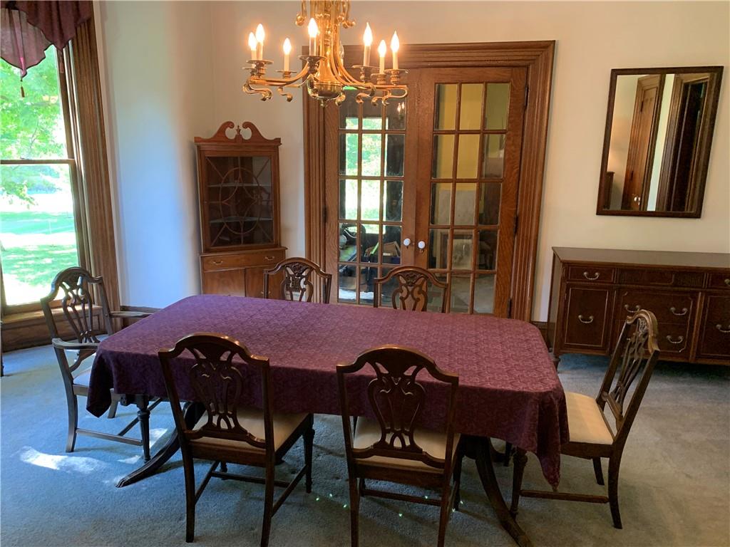 12833 Conneaut Lake Road Conneaut Lake, PA 16316 - Photo 3 of 25 a view of a dining room with furniture and window
