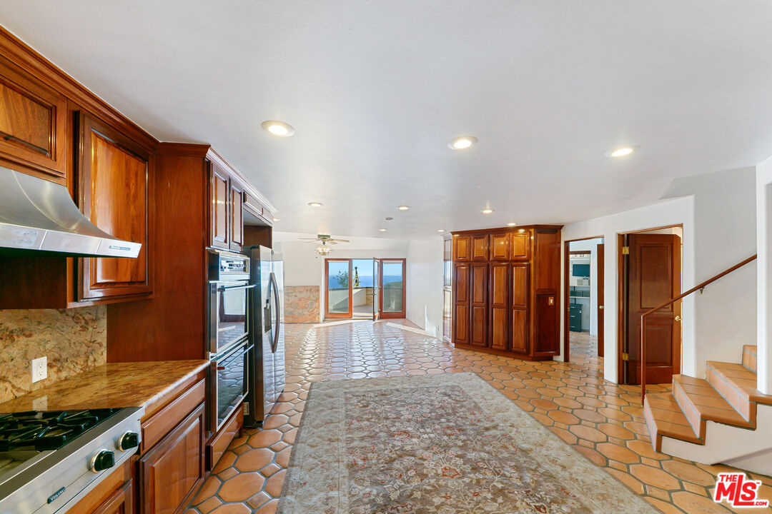 23000 Saddle Peak Road Topanga, CA 90290 - Photo 11 of 26 a view of a kitchen with stainless steel appliances granite countertop lots of counter top space