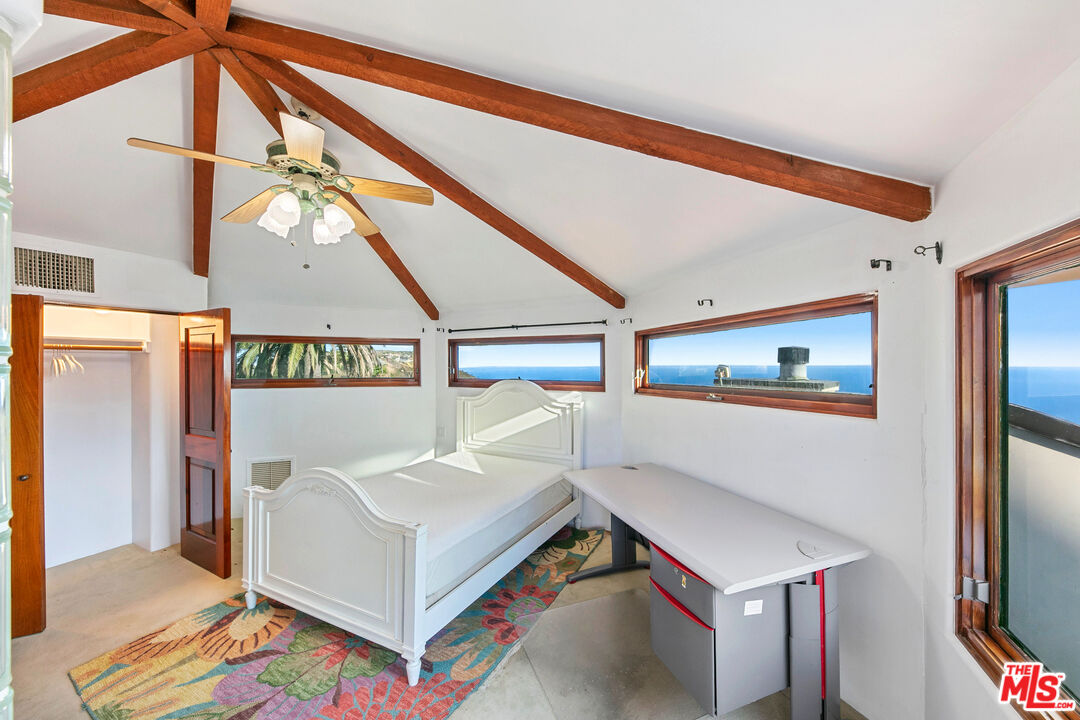23000 Saddle Peak Road Topanga, CA 90290 - Photo 17 of 26 a living room with furniture and a flat screen tv