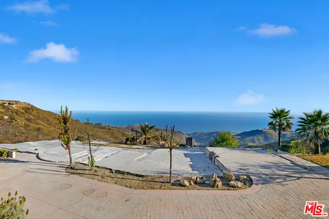 a view of a patio with furniture