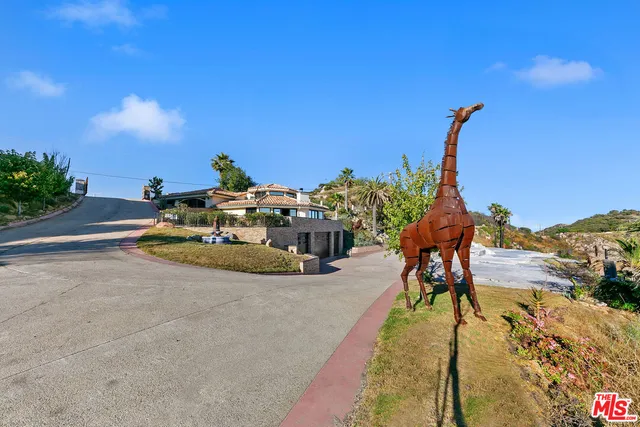 a view of a balcony with a garden