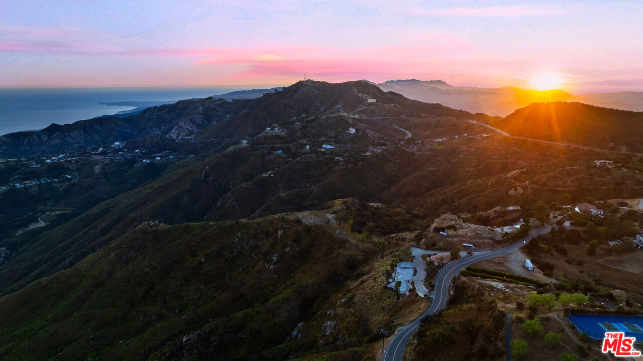 23000 Saddle Peak Road Topanga, CA 90290 - Photo 26 of 26 a view of city and a sunset