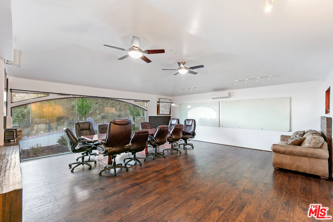 23000 Saddle Peak Road Topanga, CA 90290 - Photo 7 of 26 a living room with furniture and a large window