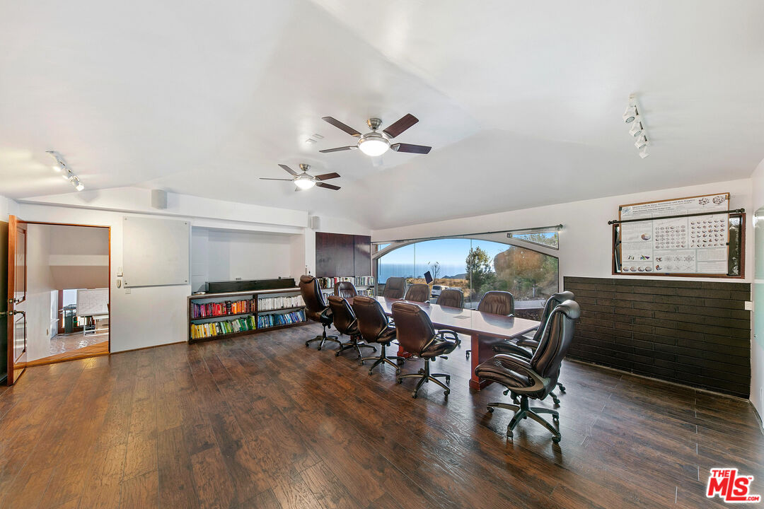 23000 Saddle Peak Road Topanga, CA 90290 - Photo 8 of 26 a living room with furniture and a wooden floor