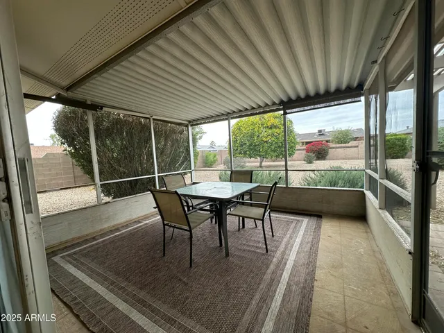 a view of a two chairs in the balcony