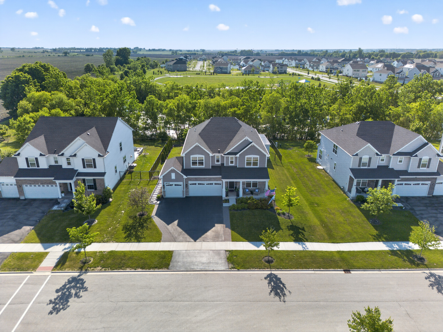 16230 Lake View Road Plainfield, IL 60586 - Photo 2 of 62 an aerial view of a house with a garden and pool