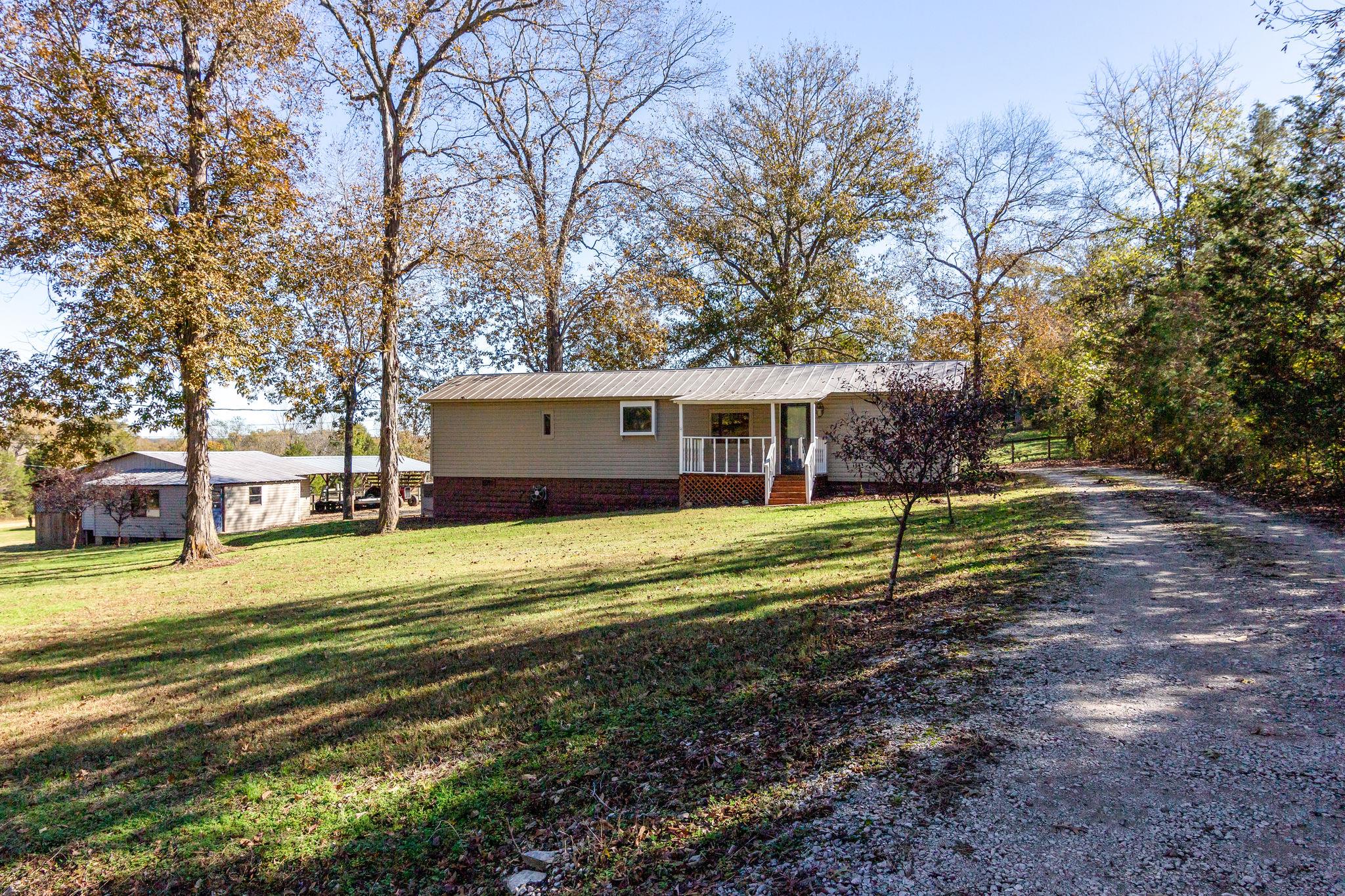 5029 Will Brown Road Spring Hill, TN 37174 - Photo 1 of 24 a view of a house with a yard and tree s